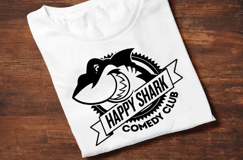 happy shark logo on t shirt